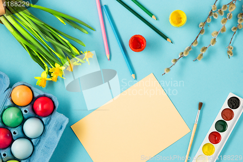 Image of The top view of easter on blue table office workplace