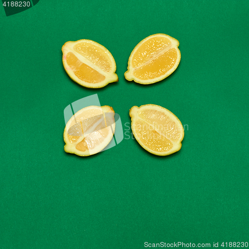 Image of Lemons on green background