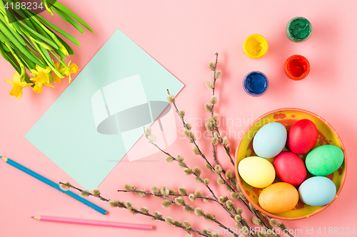 Image of The top view of easter on pink table office workplace