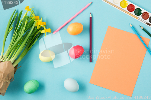 Image of The top view of easter on blue table office workplace