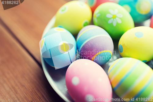 Image of close up of colored easter eggs on plate