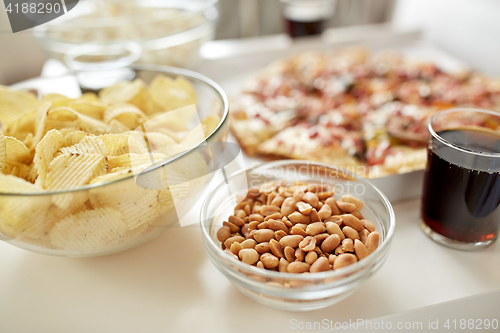 Image of close up of fast food snacks and drink on table