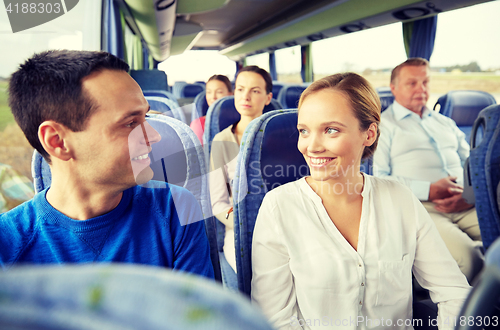 Image of group of happy passengers in travel bus