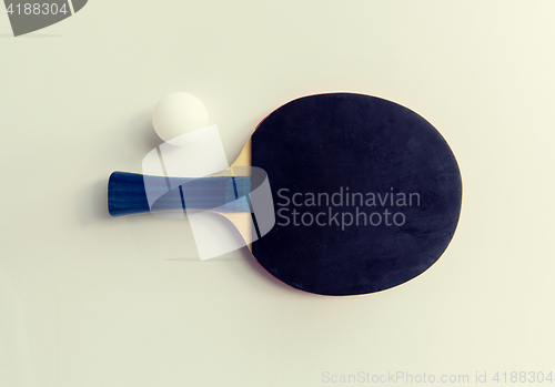 Image of close up of table tennis rackets with ball