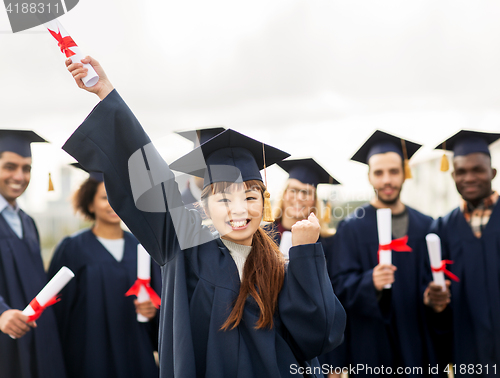 Image of happy student with diploma celebrating graduation