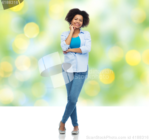 Image of happy african american young woman over white