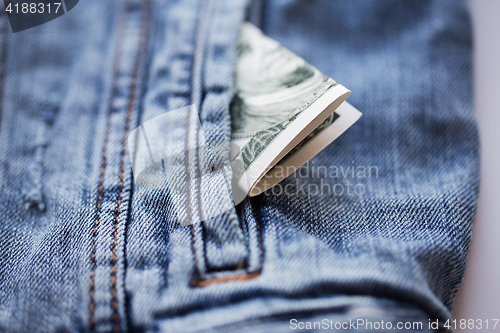 Image of dollar money in pocket of denim jacket