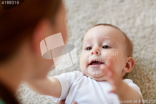 Image of close up of happy little baby and mother