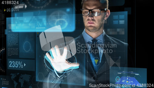 Image of businessman touching virtual screen projection