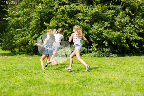 Image of group of happy kids or friends playing outdoors