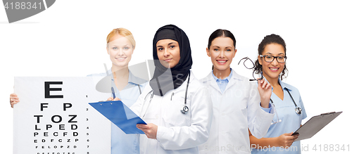 Image of doctors with clipboards, eye chart and glasses