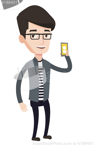 Image of Man holding ringing mobile phone.