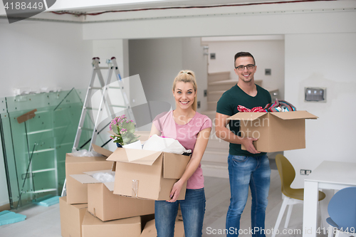 Image of young couple moving into a new home