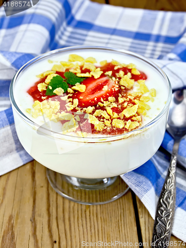 Image of Dessert milk with strawberry and flakes in bowl on board