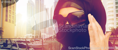 Image of close up of muslim woman in hijab and sunglasses