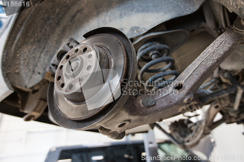 Image of car brake disc at repair station