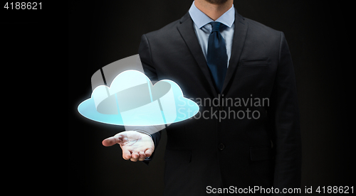 Image of close up of businessman with cloud projection