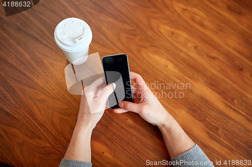 Image of close up of woman with smartphone and coffee 