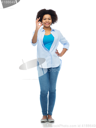 Image of happy african american woman showing ok hand sign