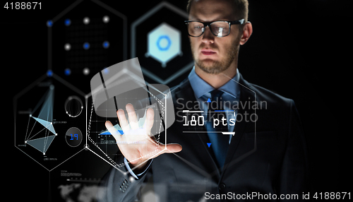 Image of businessman touching virtual screen projection