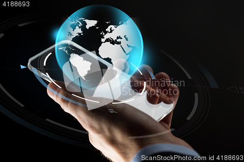 Image of businessman hand with smartphone and earth