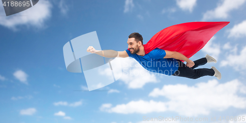 Image of happy man in red superhero cape flying on air