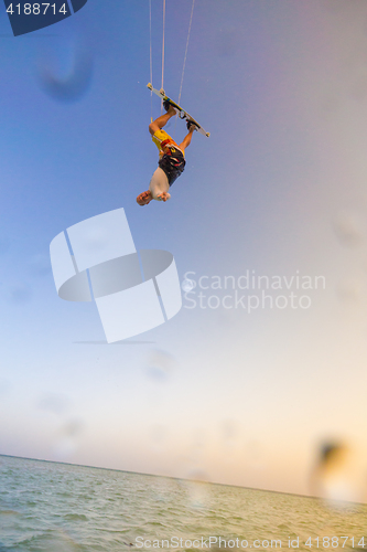 Image of Kiteboarding. Fun in ocean. Extreme Sport Kitesurfing.
