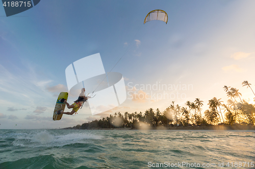 Image of Kiteboarding. Fun in ocean. Extreme Sport Kitesurfing.