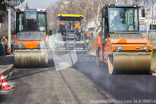 Image of Road roller compacting asphalt 