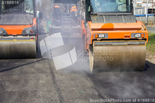 Image of Road roller compacting asphalt 