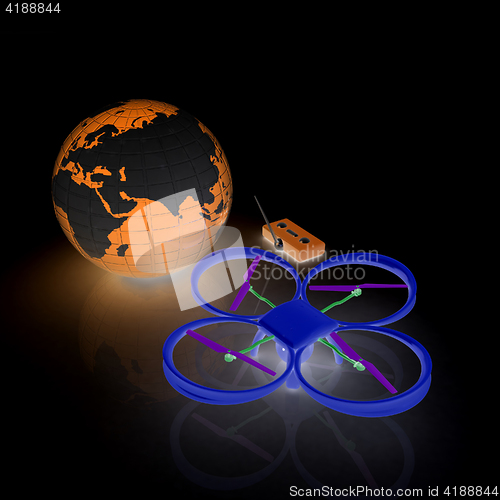 Image of Quadrocopter Drone with Earth Globe and remote controller on a w