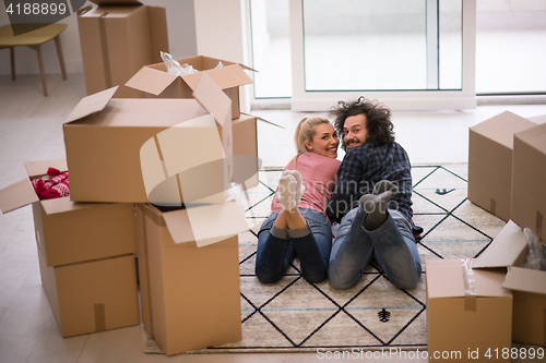 Image of Young couple moving in a new flat