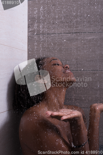 Image of African American woman in the shower