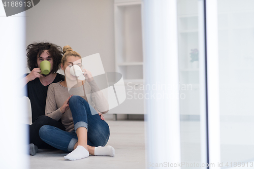 Image of young couple in their new home