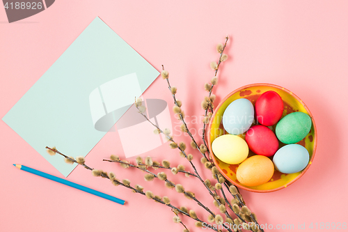 Image of The top view of easter on pink table office workplace