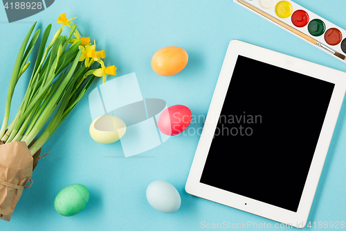 Image of The top view of easter on blue table office workplace