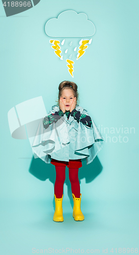 Image of Little girl posing in fashion style wearing autumn clothing.