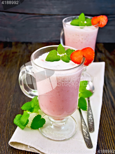 Image of Soup strawberry in goblet with spoon on board