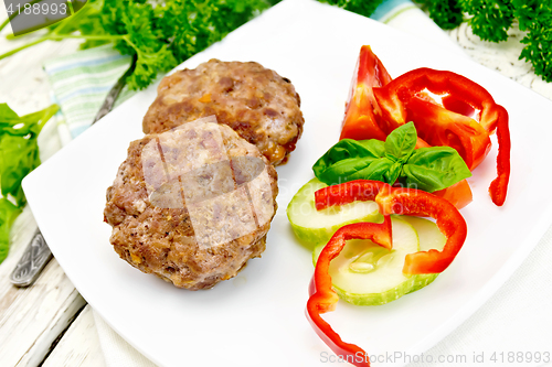 Image of Cutlets stuffed with basil on board