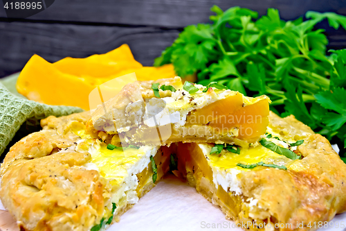 Image of  Pie of pumpkin and cheese on board