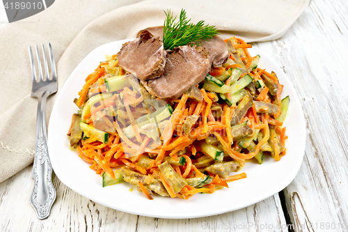 Image of Salad of tongue and carrots on board