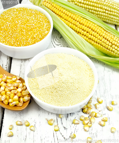 Image of Flour and grits corn in bowls with grains on board