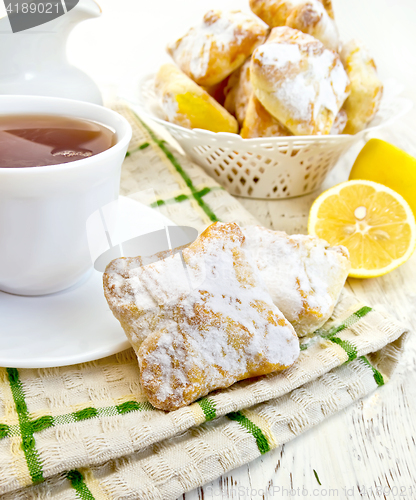 Image of Cookies lemon with tea on board