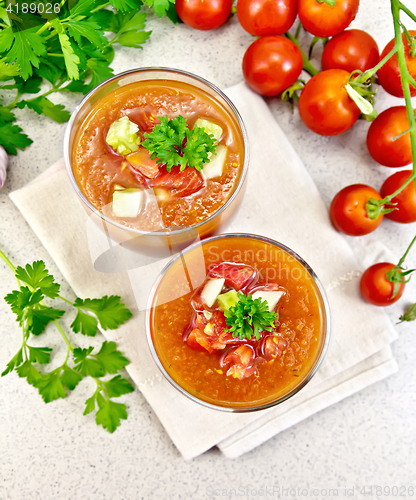 Image of Soup tomato in two glasses on granite table top