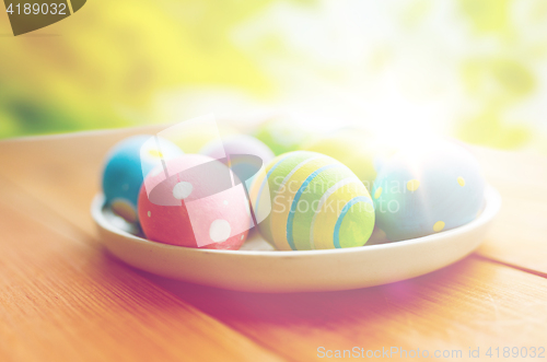 Image of close up of colored easter eggs on plate