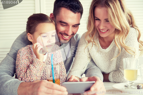 Image of happy family with smartphone at restaurant