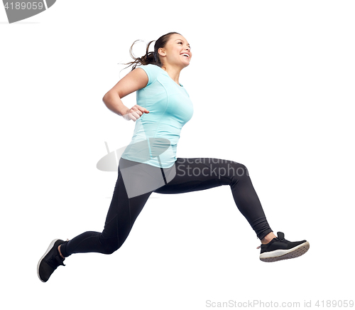 Image of happy smiling sporty young woman jumping in air