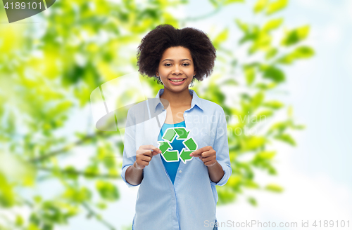 Image of happy afro american woman over natural background