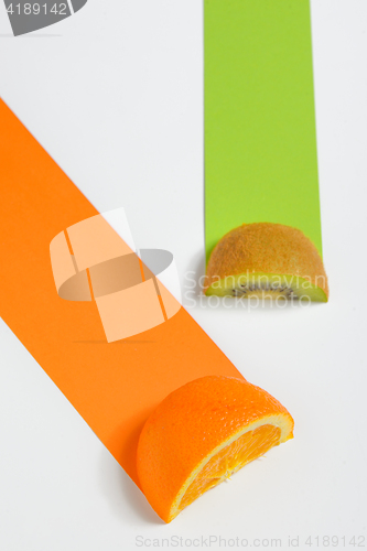 Image of Kiwi and orange fruit sliced 