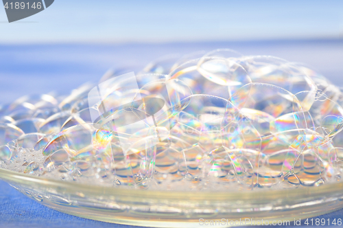 Image of soap bubbles on blue background